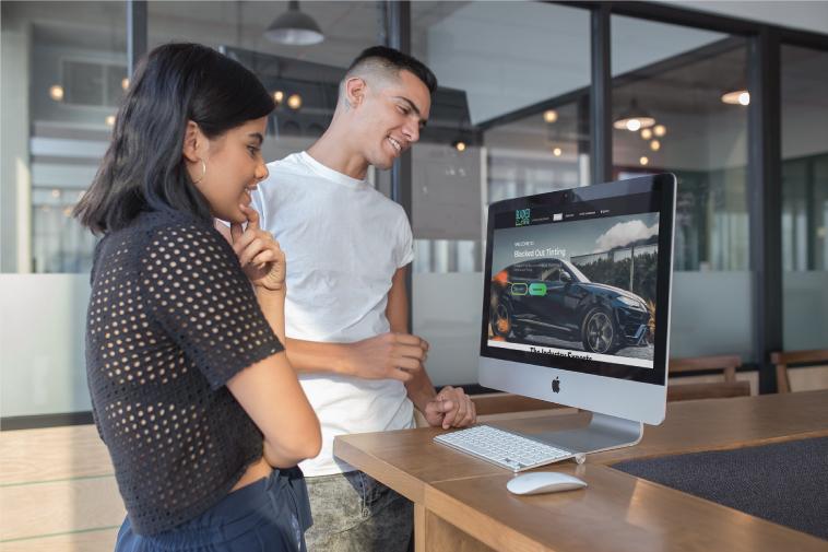 Kepler Agency team reviewing analytics and website performance on a desktop computer
